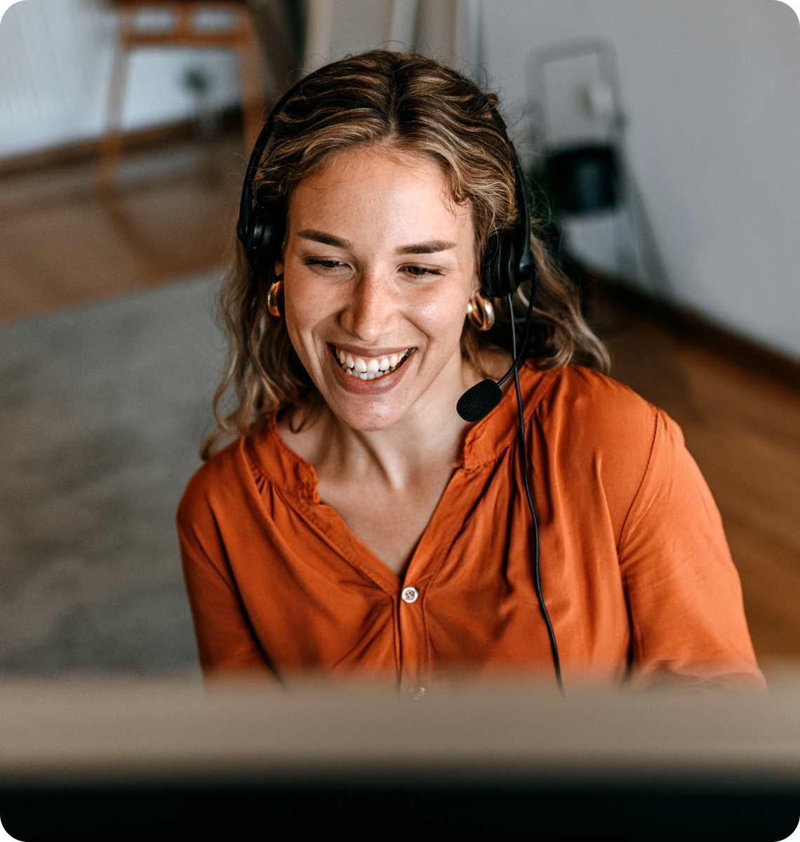 Woman wearing a headphones and smiling