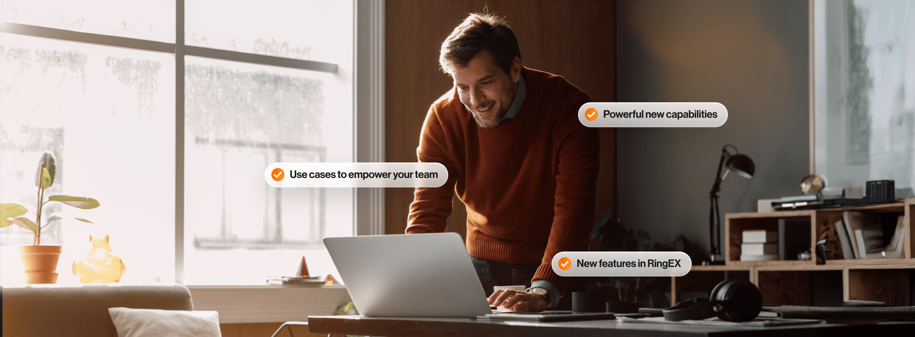 A man typing at a laptop